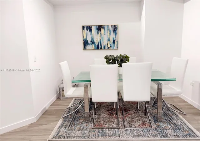 a large bed sitting in a bedroom next to a lamp