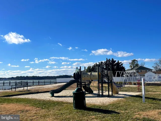 a view of a swimming pool with an outdoor seating