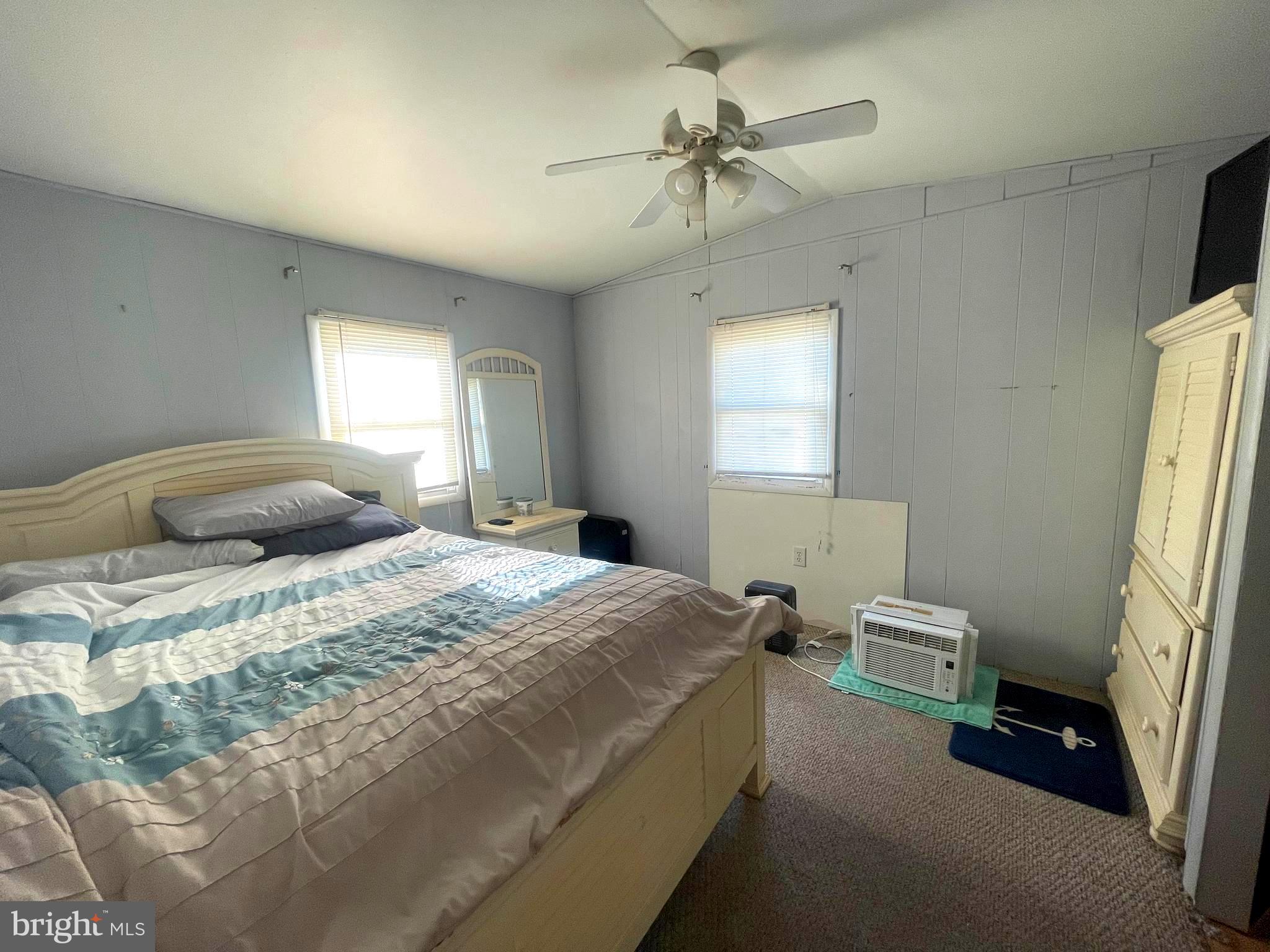 21720 B Street Rehoboth Beach, DE 19971 - Photo 8 of 23 a bedroom with a bed and a window