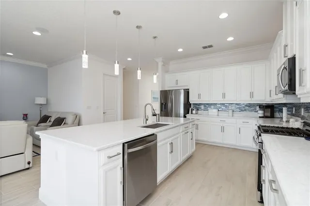 a view of a lake with houses in the background