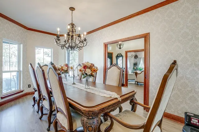 a view of a dining room with furniture and window