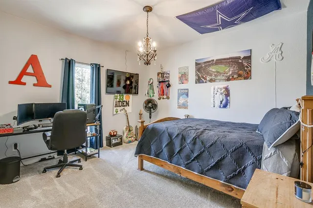 a bedroom with a workspace