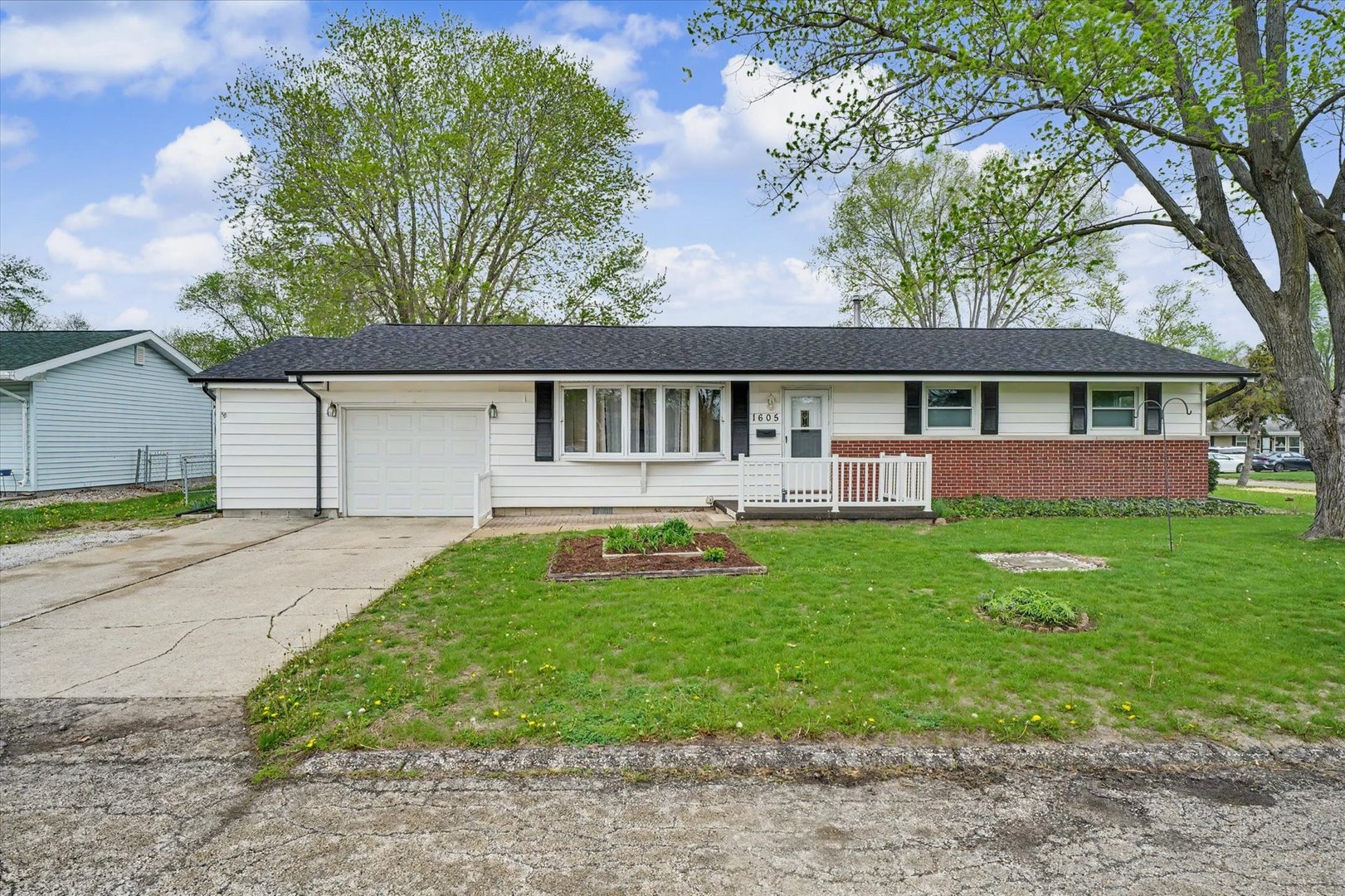 1605 Grange Drive Rantoul, IL 61866 - Photo 1 of 26 a house view with a garden space
