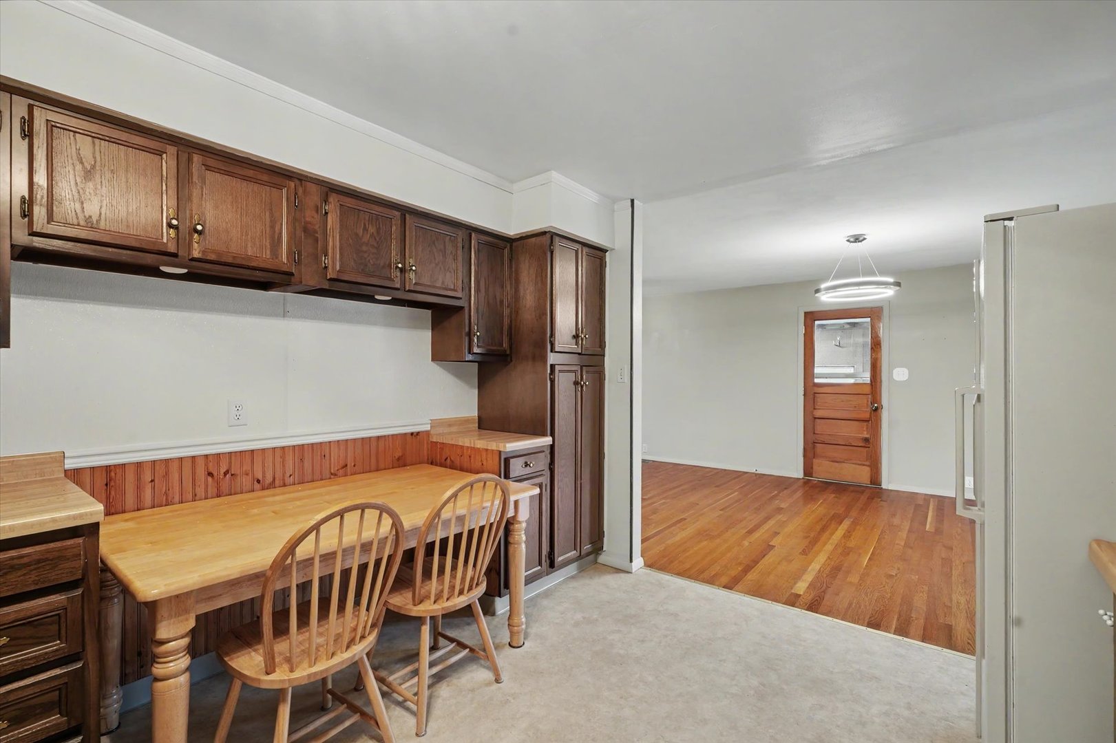 1605 Grange Drive Rantoul, IL 61866 - Photo 13 of 26 a view of a kitchen with furniture and wooden cabinets