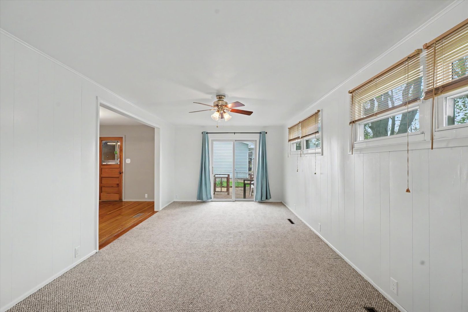 1605 Grange Drive Rantoul, IL 61866 - Photo 15 of 26 a view of an empty room with wooden floor and a window
