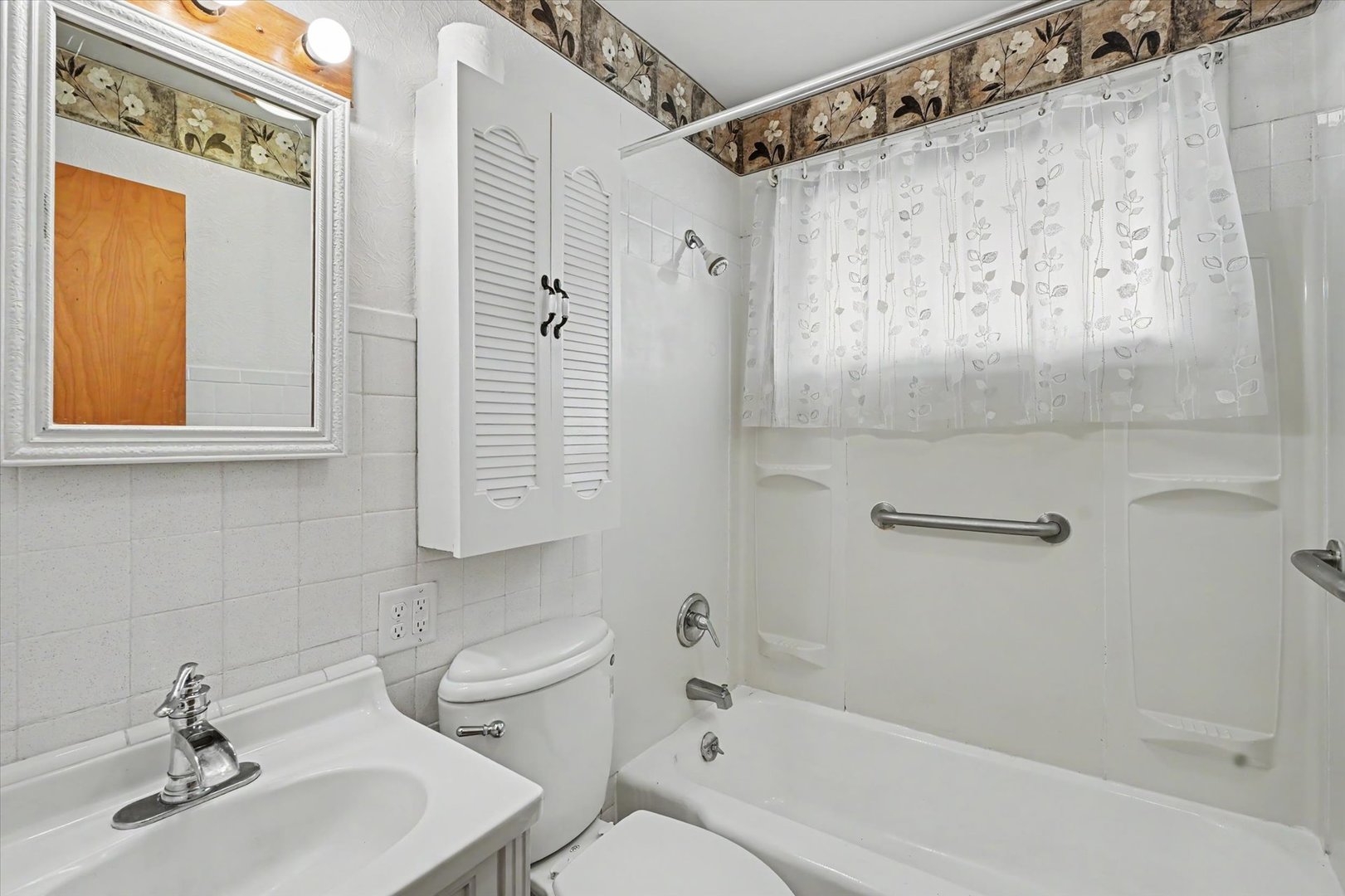 1605 Grange Drive Rantoul, IL 61866 - Photo 22 of 26 a bathroom with a sink a toilet and shower