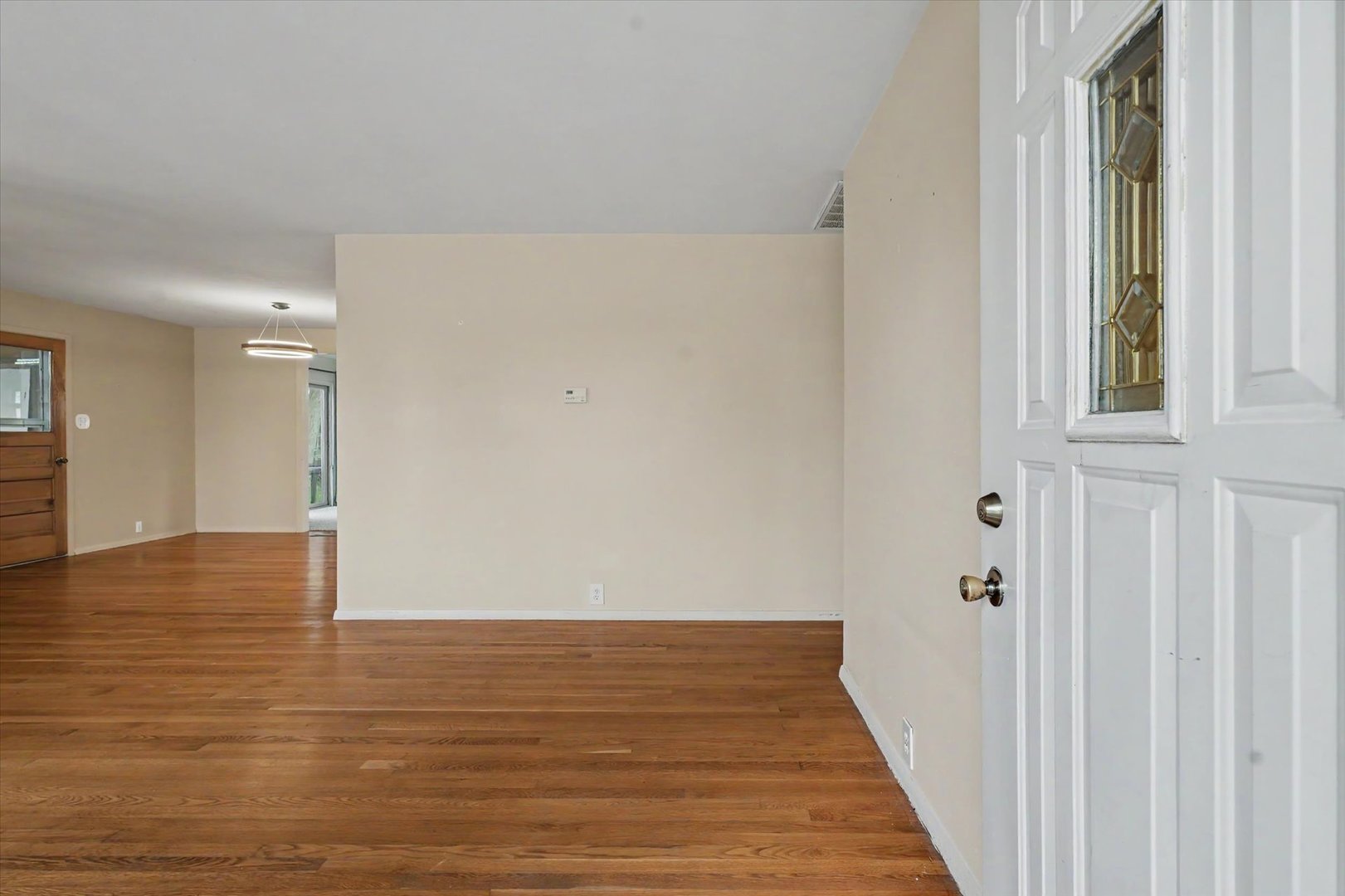 1605 Grange Drive Rantoul, IL 61866 - Photo 4 of 26 a view of a hallway with wooden floor