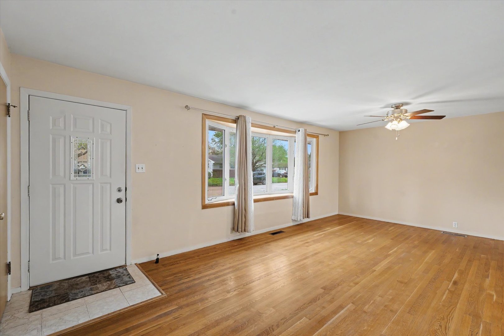 1605 Grange Drive Rantoul, IL 61866 - Photo 5 of 26 a view of an empty room with glass door