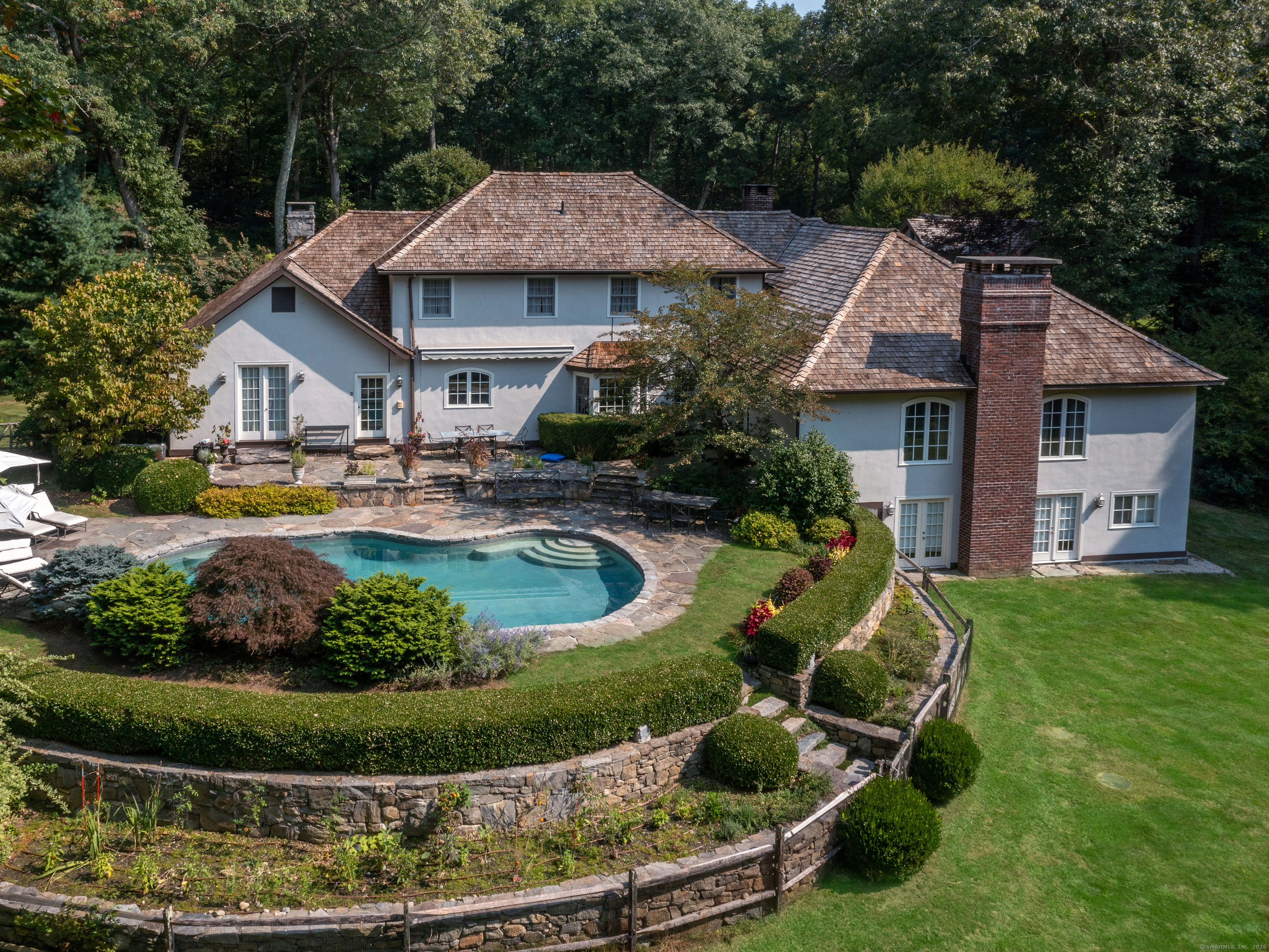 Undisclosed Address Roxbury, CT 06783 - Photo 1 of 1 a aerial view of a house with swimming pool and garden