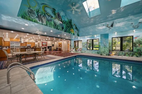 a view of a patio with dining table and chairs