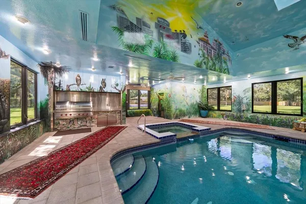 a kitchen with lots of counter top space and wooden floor
