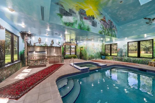 a living room with furniture and a bookshelf