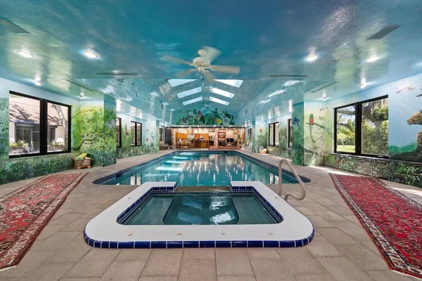 a living room with furniture and a bookshelf