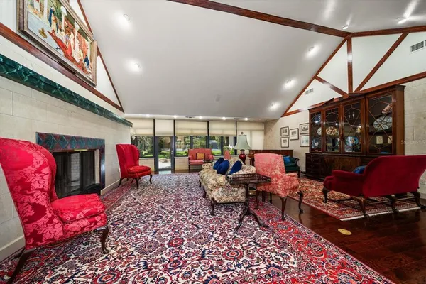 a view of entryway bedroom and hall with wooden floor
