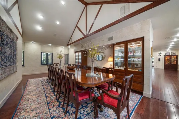 a large kitchen with kitchen island a large window
