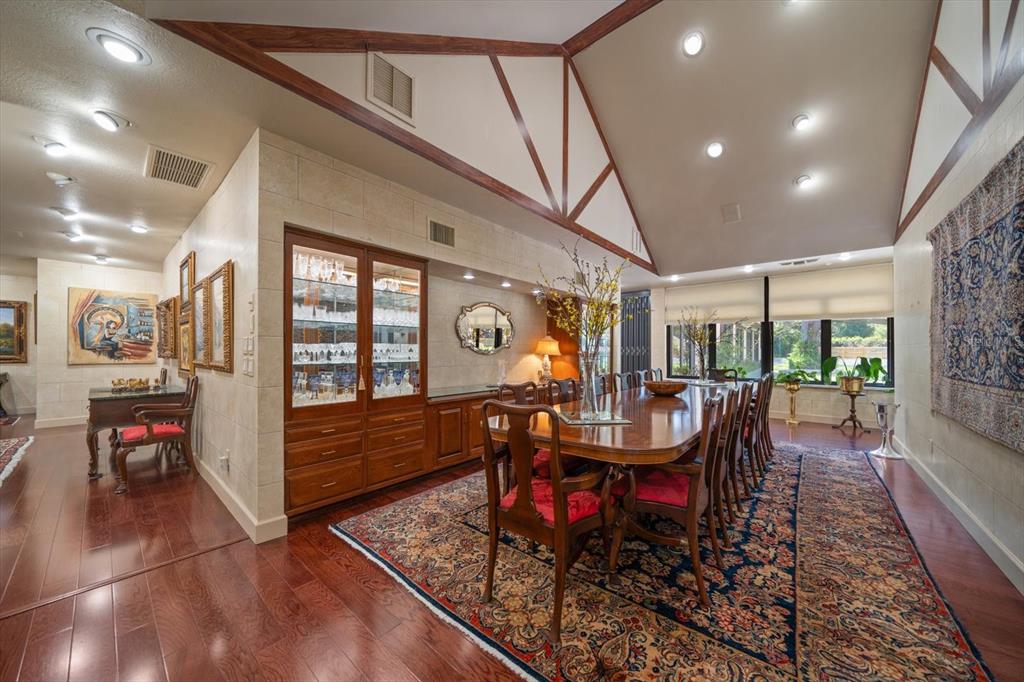 1835 Alicia Way Clearwater, FL 33764 - Photo 25 of 89 a dining room with furniture water view and wooden floor