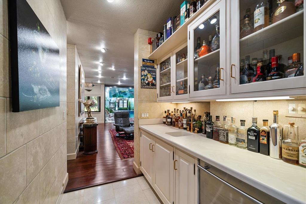 1835 Alicia Way Clearwater, FL 33764 - Photo 30 of 89 a kitchen with lots of counter top space and wooden floor