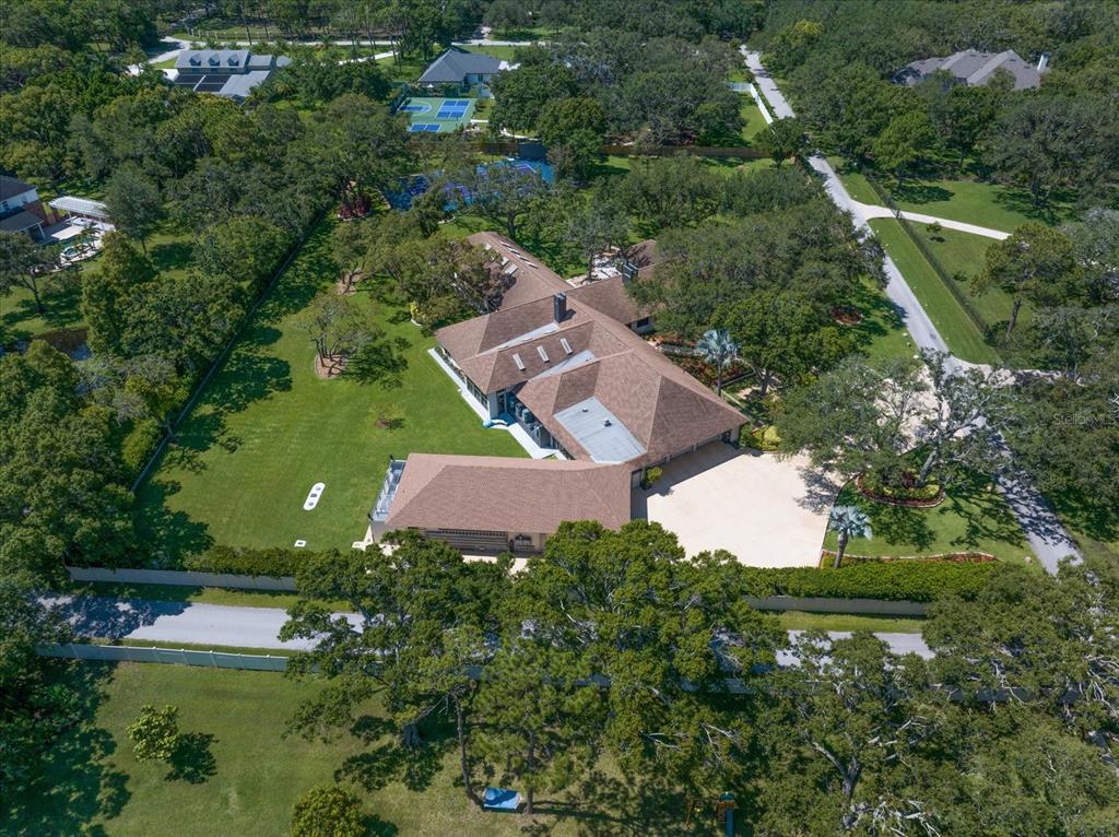 1835 Alicia Way Clearwater, FL 33764 - Photo 3 of 89 an aerial view of a house with a yard and lake view