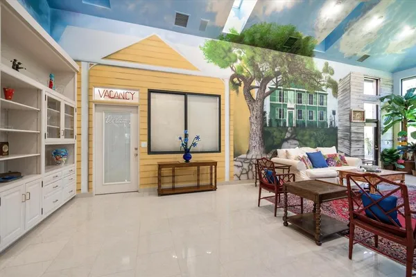 a dining room with furniture and wooden floor