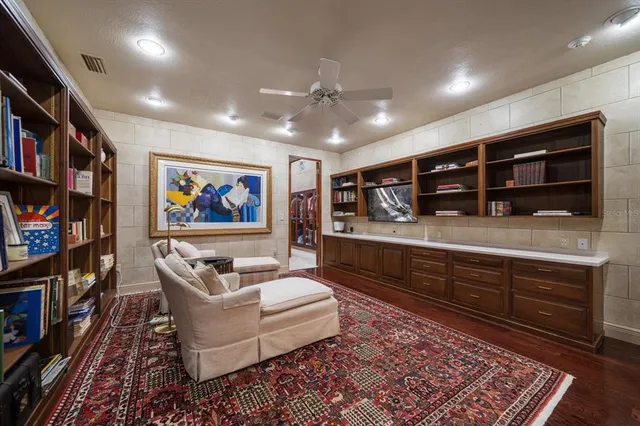 a bed room with a bed and a chair