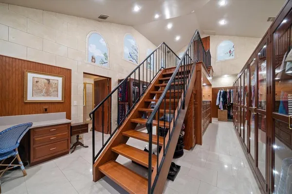 a living room with furniture and a floor to ceiling window