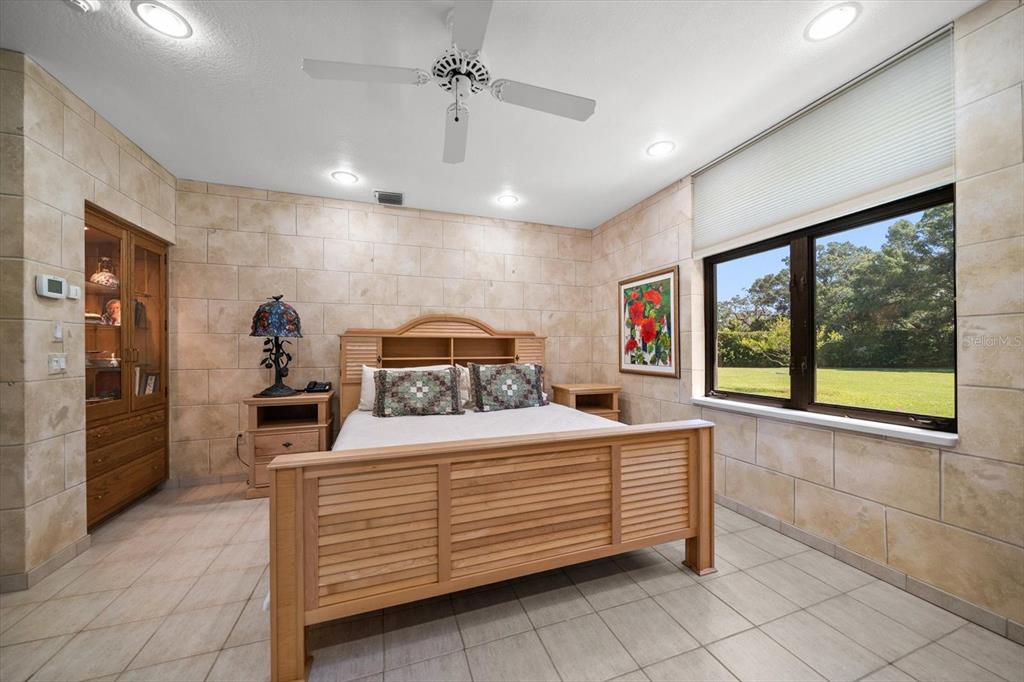 1835 Alicia Way Clearwater, FL 33764 - Photo 49 of 89 a bedroom with a large bed and a large window