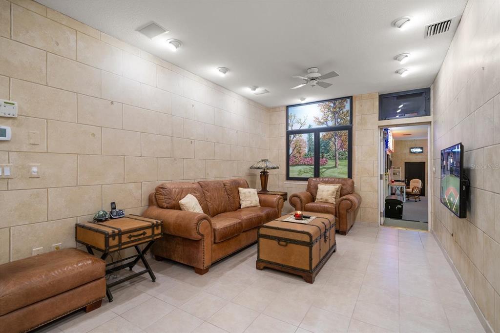 1835 Alicia Way Clearwater, FL 33764 - Photo 51 of 89 a living room with furniture and a flat screen tv