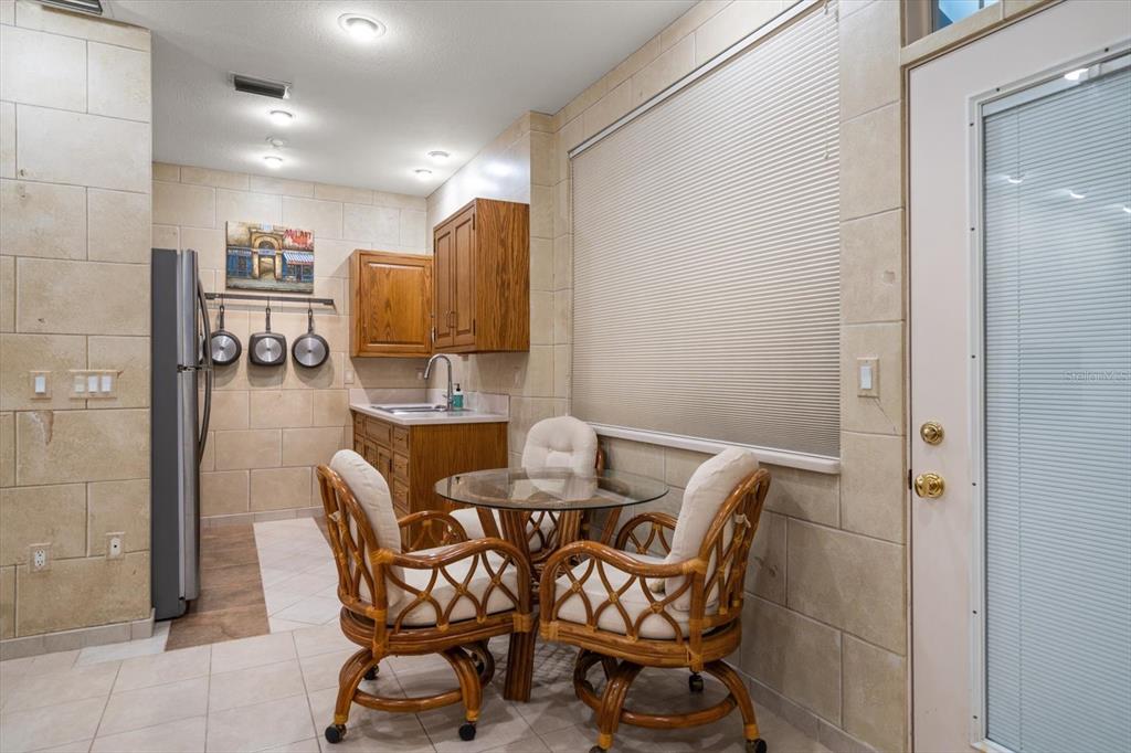1835 Alicia Way Clearwater, FL 33764 - Photo 52 of 89 a dining room with furniture and wooden floor