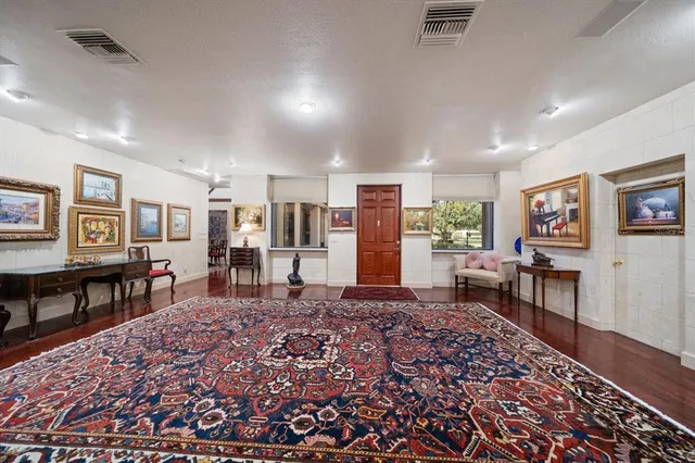 a living room with furniture and a rug