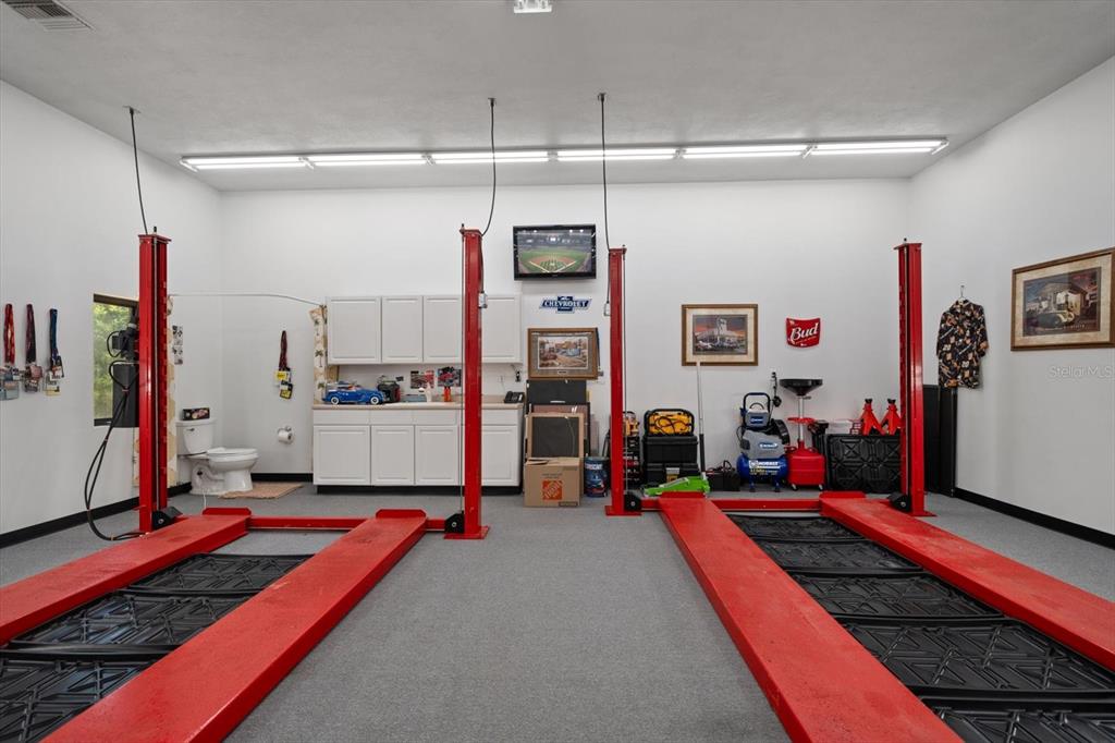 1835 Alicia Way Clearwater, FL 33764 - Photo 63 of 89 a living room with lots of furniture and air hockey table