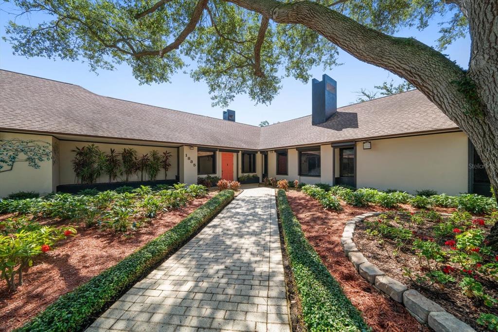 1835 Alicia Way Clearwater, FL 33764 - Photo 7 of 89 a front view of a house with a garden
