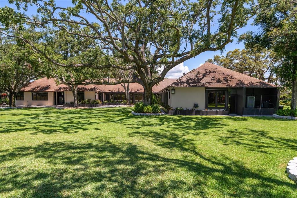 1835 Alicia Way Clearwater, FL 33764 - Photo 72 of 89 a front view of a house with a garden