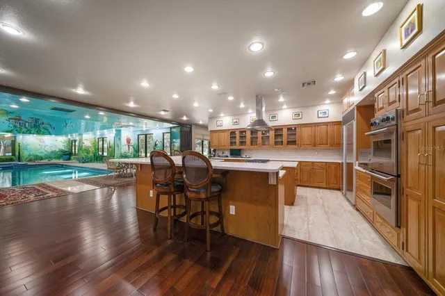 a view of a swimming pool and outdoor seating