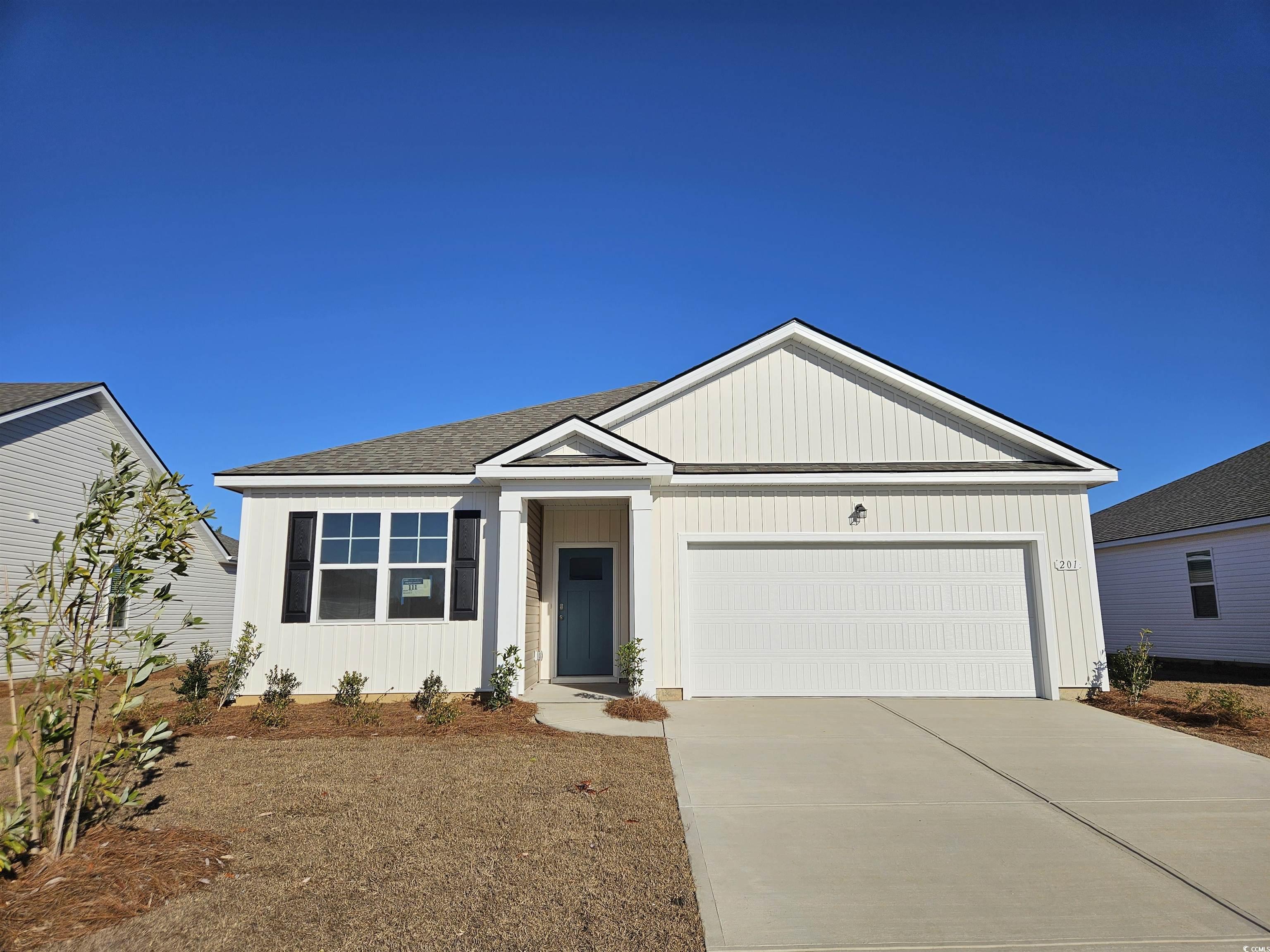 7319 Meadow Walk Loop Loris, SC 29569 - Photo 1 of 14 Single story home featuring a garage, concrete dri
