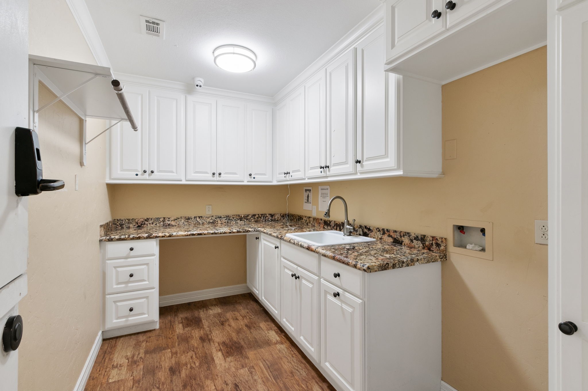 17018 Grant Road Cypress, TX 77429 - Photo 16 of 50 a kitchen with granite countertop a sink stove and cabinets