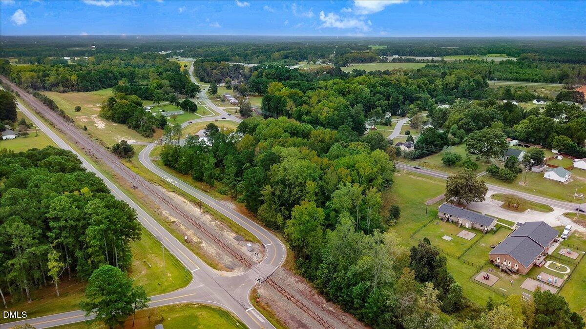 195 Main Street Smithfield, NC 27577 - Photo 11 of 14 an aerial view of residential houses with outdoor space and trees