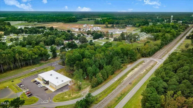 a view of a garden with a building in the background
