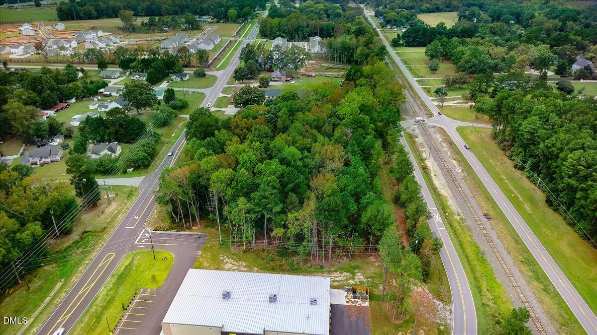 195 Main Street Smithfield, NC 27577 - Photo 6 of 14 a view of swimming pool with a garden and trees