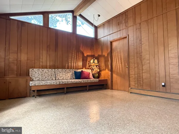 a bedroom with furniture and window