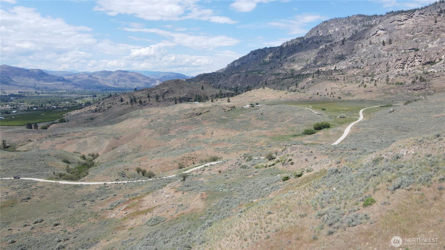 -lot B Swanson Mill Road Oroville, WA 98844 - Photo 13 of 13 a view of a dry field with mountains in the background