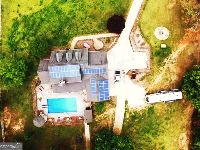 a bedroom with bed and window