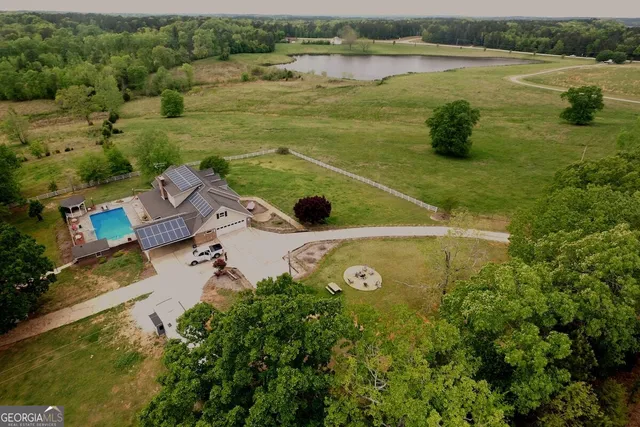 a spacious bedroom with a bed and a table in it