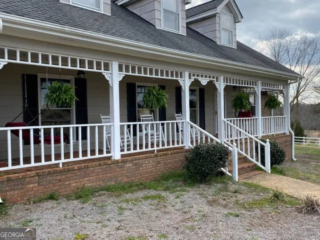 a large kitchen with stainless steel appliances granite countertop a sink counter space cabinets and a large window