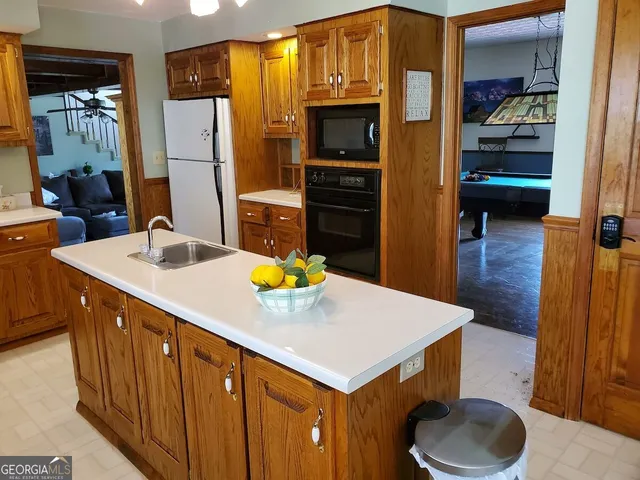 a view of a balcony with yard