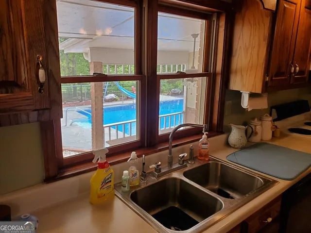 a view of a balcony with table and chairs