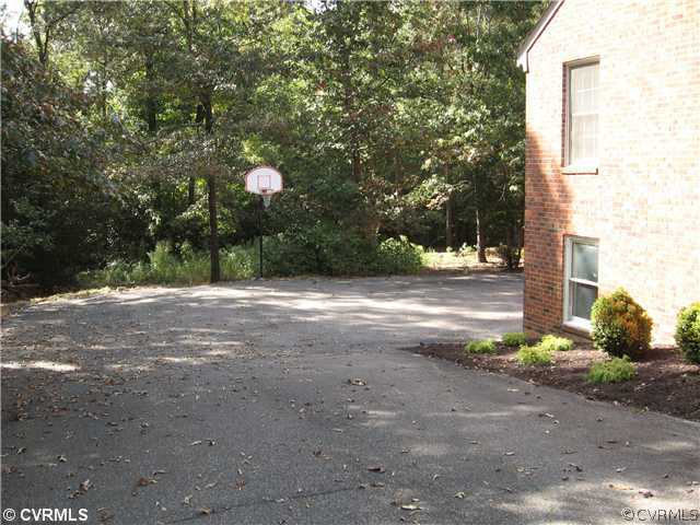 10930 Cherrybark Road Chester, VA 23831 - Photo 14 of 14 a backyard of a house with lots of green space