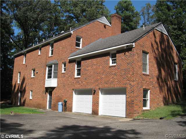 10930 Cherrybark Road Chester, VA 23831 - Photo 5 of 14 a front view of a house with a yard