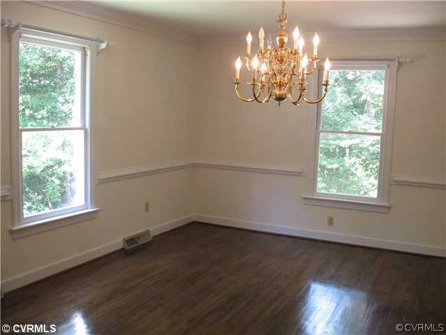 10930 Cherrybark Road Chester, VA 23831 - Photo 8 of 14 a view of a room with wooden floor chandelier and windows