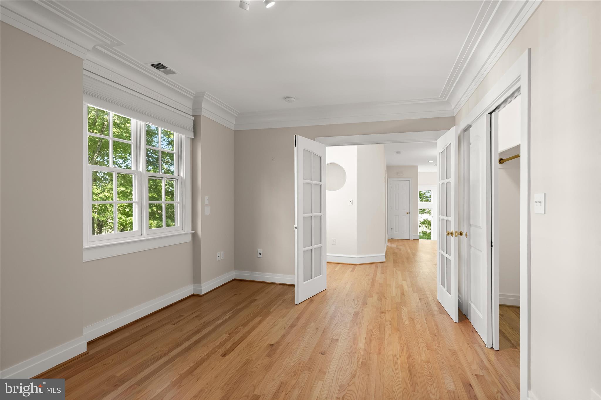 5104 Scarsdale Road Bethesda, MD 20816 - Photo 46 of 68 a view of a room with wooden floor and windows
