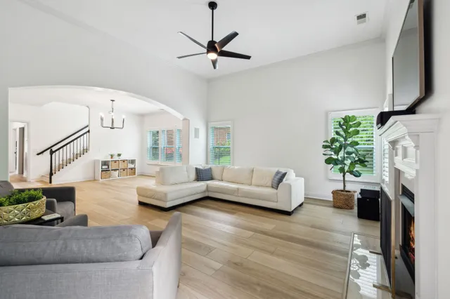a living room with furniture and a fireplace